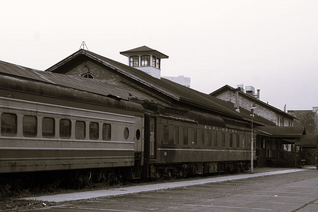 Black and white photo of The Freighthouse with the haunted freight trains. 