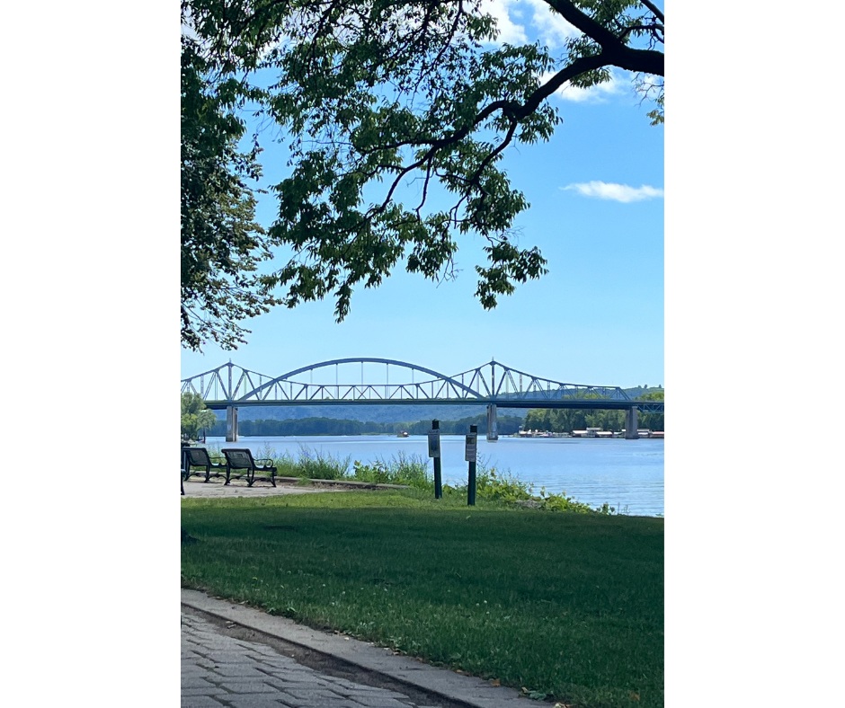 view of the Mississippi River with two blue bridges in the background