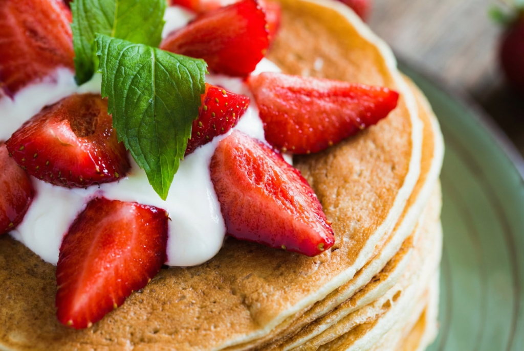 Stack of pancakes with berries to go with Hollandberry Pannekoeken La Crosse location