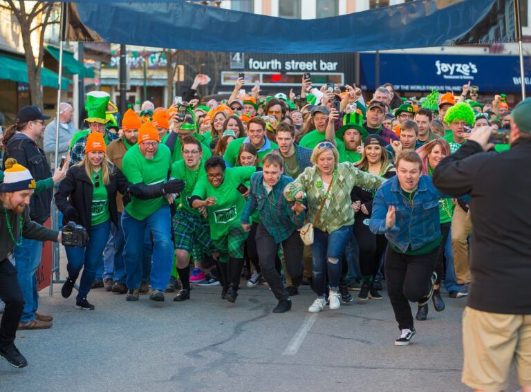La Crosse Area residents dressed in green and orange at the start line of the 0.01k St. Patrick's Day Race.